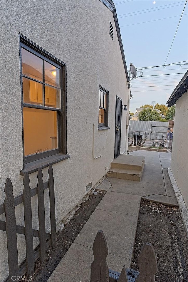 550 N 1st Ave, Upland, CA 91786 - view of side of property with stucco siding and a patio