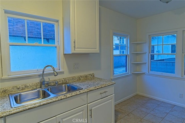 550 N 1st Ave, Upland, CA 91786 - kitchen with a sink, white cabinets, baseboards, and light tile patterned floors