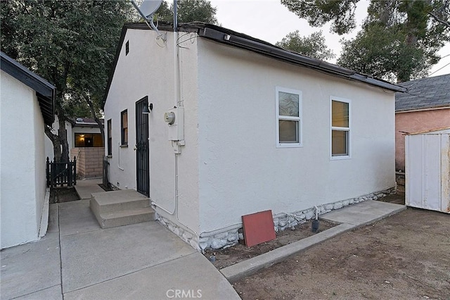 550 N 1st Ave, Upland, CA 91786 - view of side of property featuring stucco siding and a patio