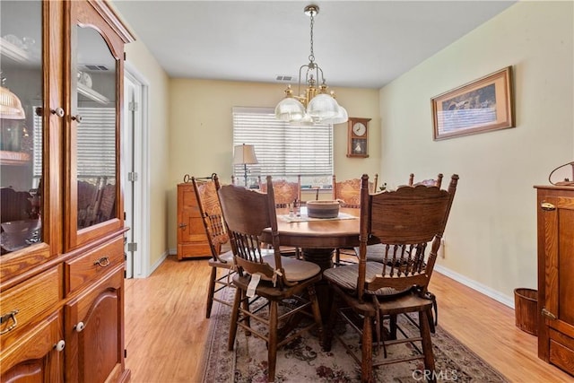 1350 Cardo Way, Nipomo, CA 93444 - dining room with a chandelier, light wood-style floors, and baseboards