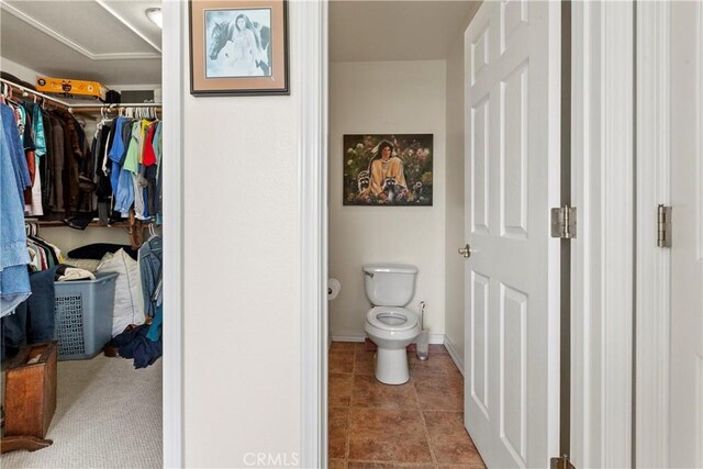 1350 Cardo Way, Nipomo, CA 93444 - bathroom with toilet, a walk in closet, tile patterned flooring, and baseboards