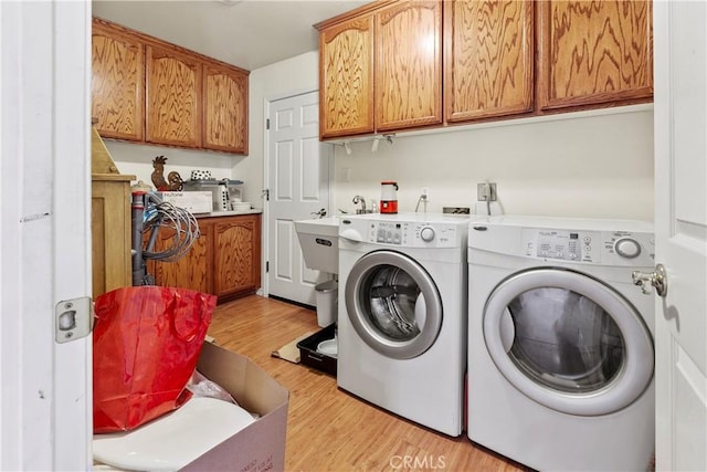 1350 Cardo Way, Nipomo, CA 93444 - washroom with separate washer and dryer, cabinet space, and light wood-style floors
