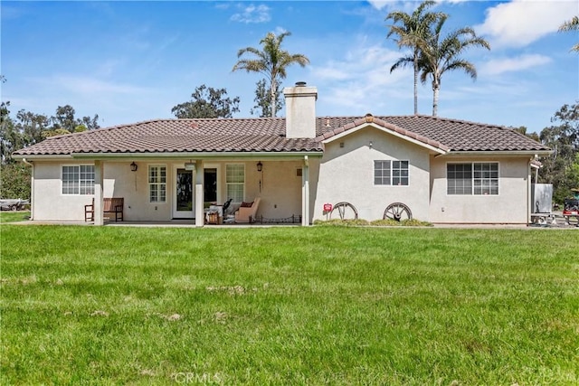 1350 Cardo Way, Nipomo, CA 93444 - back of house featuring a chimney, stucco siding, and a yard