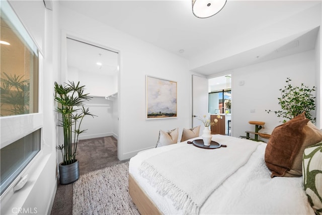 709 E Walnut St Unit 415, Pasadena, CA 91101 - carpeted bedroom with baseboards and a spacious closet
