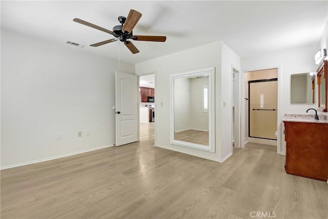 27057 Rangewood St, Menifee, CA 92586 - unfurnished bedroom with light wood-style floors, baseboards, a sink, and a ceiling fan