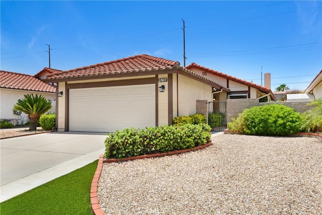 27057 Rangewood St, Menifee, CA 92586 - view of front of house with stucco siding, a garage, driveway, and a tiled roof