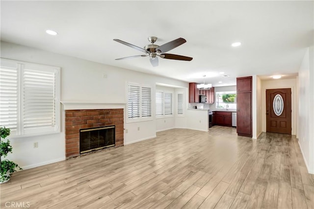 27057 Rangewood St, Menifee, CA 92586 - unfurnished living room featuring a ceiling fan, light wood finished floors, baseboards, a fireplace, and recessed lighting