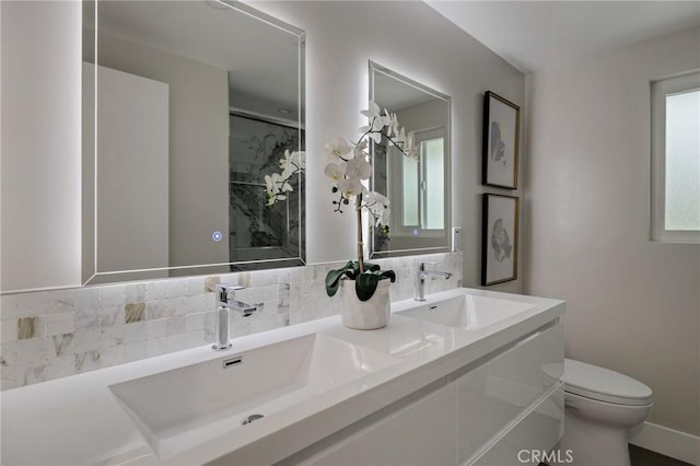 2817 San Ramon Dr, Rancho Palos Verdes, CA 90275 - bathroom featuring toilet, tasteful backsplash, double vanity, a shower, and baseboards