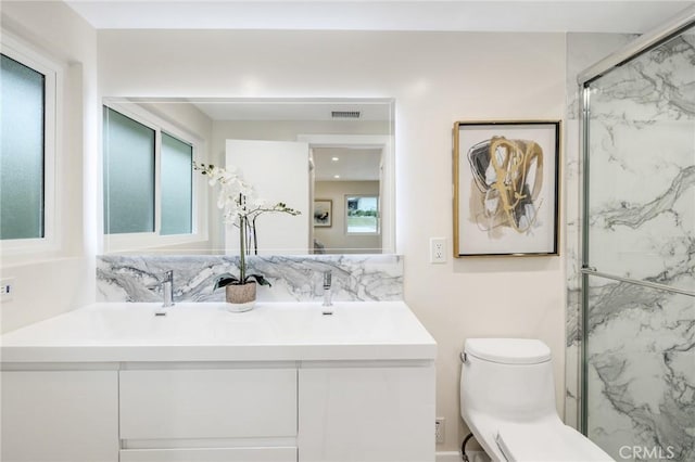 2817 San Ramon Dr, Rancho Palos Verdes, CA 90275 - bathroom featuring vanity, toilet, a marble finish shower, and tasteful backsplash