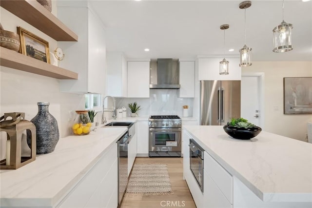 2817 San Ramon Dr, Rancho Palos Verdes, CA 90275 - kitchen with high quality appliances, wall chimney exhaust hood, modern cabinets, white cabinets, and recessed lighting