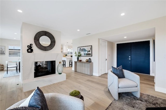 2817 San Ramon Dr, Rancho Palos Verdes, CA 90275 - living area with light wood-style floors, recessed lighting, baseboards, and a premium fireplace