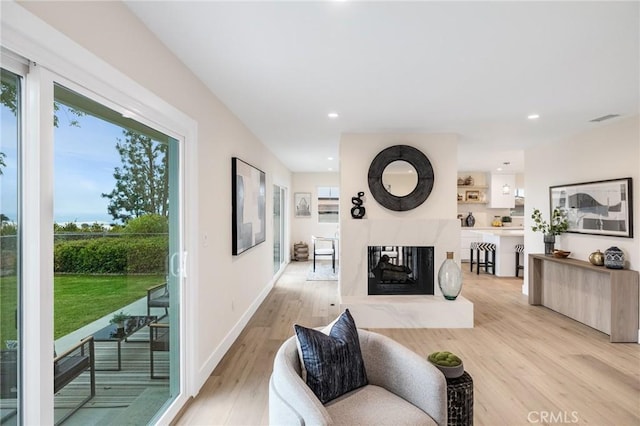 2817 San Ramon Dr, Rancho Palos Verdes, CA 90275 - living room with light wood finished floors, recessed lighting, a premium fireplace, and baseboards