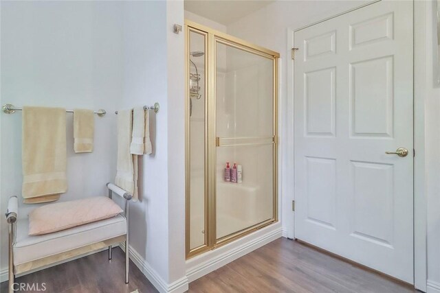 240 Portal St, Oak View, CA 93022 - bathroom featuring a stall shower, wood finished floors, and baseboards