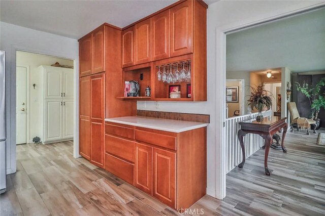 240 Portal St, Oak View, CA 93022 - kitchen featuring light wood-style floors, light countertops, and open shelves