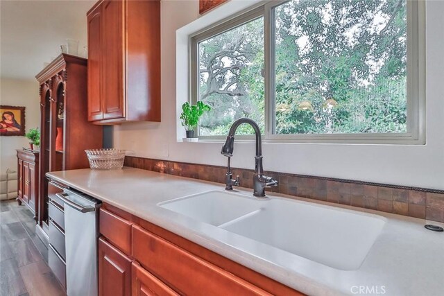 240 Portal St, Oak View, CA 93022 - kitchen featuring a sink, light countertops, brown cabinets, and dishwasher