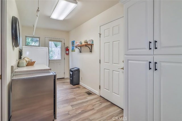 240 Portal St, Oak View, CA 93022 - laundry area featuring washer / clothes dryer, light wood-style floors, and baseboards