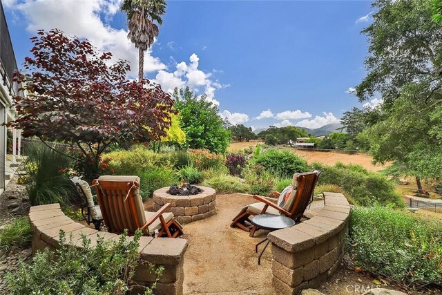 240 Portal St, Oak View, CA 93022 - view of patio / terrace featuring an outdoor fire pit