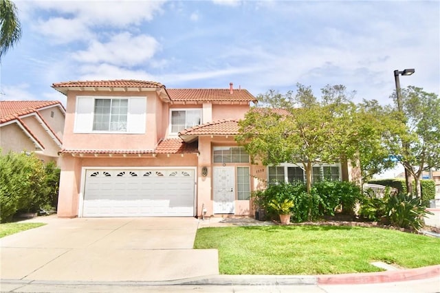 1550 Balsam Dr, Pomona, CA 91766 - mediterranean / spanish home with a tiled roof, concrete driveway, a garage, stucco siding, and a front yard