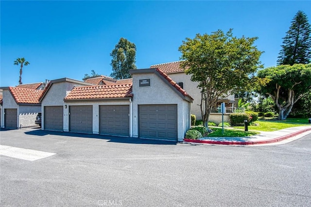 28282 Sorrento Unit 147, Laguna Niguel, CA 92677 - mediterranean / spanish-style home featuring community garages, a tile roof, and stucco siding