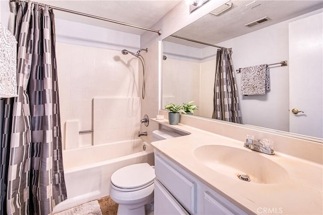 28282 Sorrento Unit 147, Laguna Niguel, CA 92677 - bathroom featuring vanity, shower / bath combo with shower curtain, toilet, and a textured ceiling