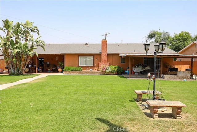 5685 Ptolemy Way, Jurupa Valley, CA 91752 - back of property featuring a yard