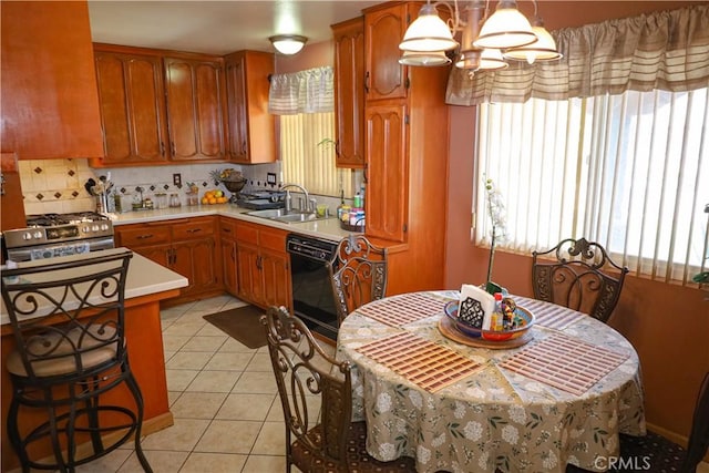 5685 Ptolemy Way, Jurupa Valley, CA 91752 - kitchen featuring dishwasher, a sink, light countertops, and plenty of natural light
