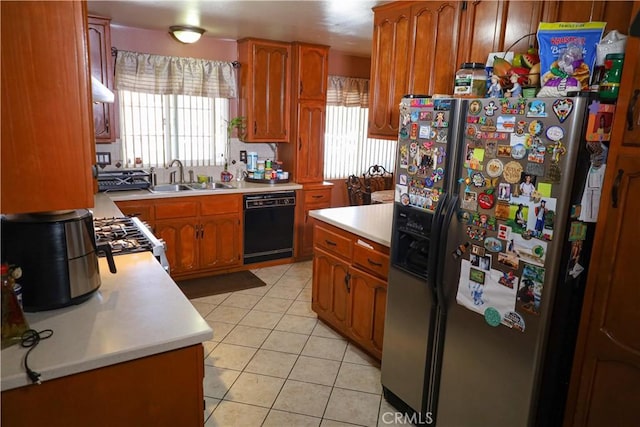 5685 Ptolemy Way, Jurupa Valley, CA 91752 - kitchen with fridge with ice dispenser, dishwasher, a sink, light countertops, and stainless steel gas range oven