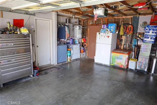 5685 Ptolemy Way, Jurupa Valley, CA 91752 - garage featuring freestanding refrigerator, strapped water heater, and a garage door opener