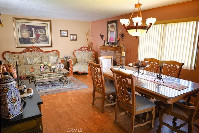 5685 Ptolemy Way, Jurupa Valley, CA 91752 - dining area with a chandelier and wood finished floors