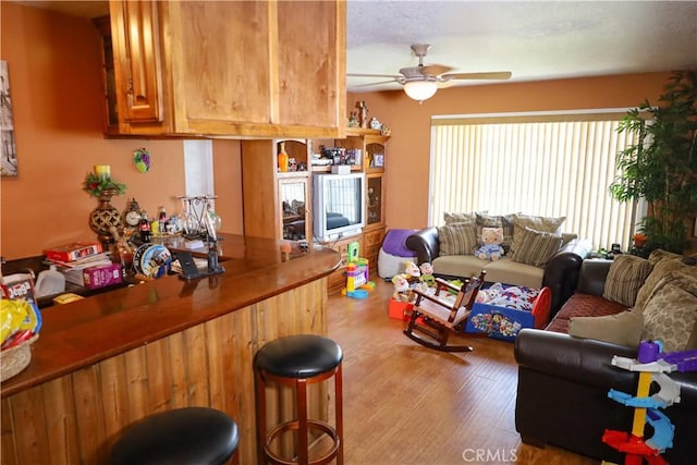 5685 Ptolemy Way, Jurupa Valley, CA 91752 - bar area featuring a ceiling fan and wood finished floors