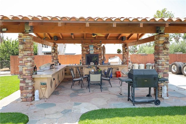 5685 Ptolemy Way, Jurupa Valley, CA 91752 - fenced backyard featuring a gazebo, a ceiling fan, a patio, and outdoor dining space