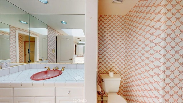 12 Pinto Ln, Rolling Hills Estates, CA 90274 - bathroom with vanity, wallpapered walls, and recessed lighting
