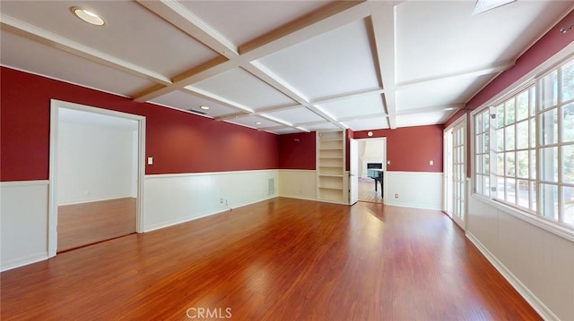 12 Pinto Ln, Rolling Hills Estates, CA 90274 - unfurnished living room featuring coffered ceiling, wood finished floors, wainscoting, a fireplace, and beam ceiling
