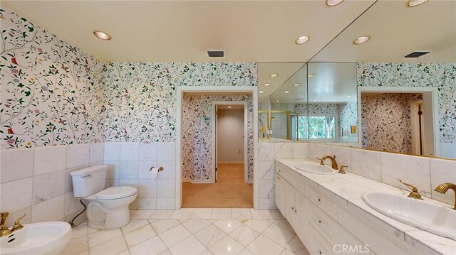 12 Pinto Ln, Rolling Hills Estates, CA 90274 - bathroom with wallpapered walls, a bidet, double vanity, recessed lighting, and tile patterned flooring