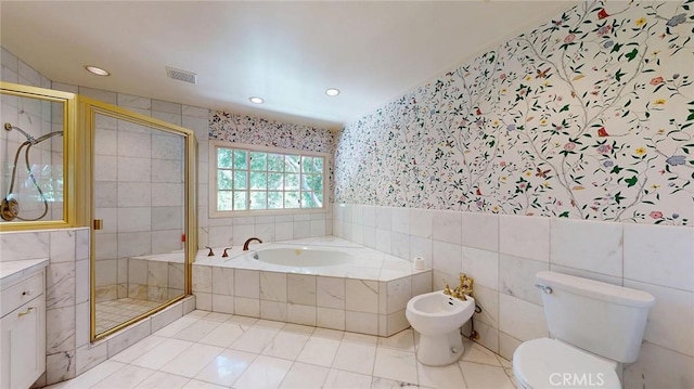 12 Pinto Ln, Rolling Hills Estates, CA 90274 - full bathroom featuring wallpapered walls, a garden tub, tile walls, a shower stall, and a bidet