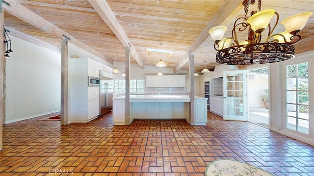 12 Pinto Ln, Rolling Hills Estates, CA 90274 - kitchen with appliances with stainless steel finishes, wooden ceiling, white cabinets, light countertops, and brick flooring