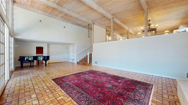 12 Pinto Ln, Rolling Hills Estates, CA 90274 - living area with brick floors, a wooden ceiling with exposed beams, stairway, and high vaulted ceiling
