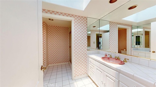 12 Pinto Ln, Rolling Hills Estates, CA 90274 - full bathroom featuring wallpapered walls, tile patterned flooring, vanity, and a skylight