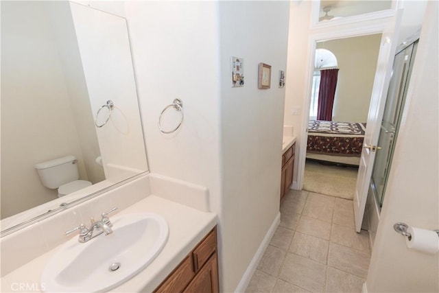 337 W Trenton Ave, Clovis, CA 93619 - bathroom with ensuite bathroom, vanity, a stall shower, and tile patterned floors