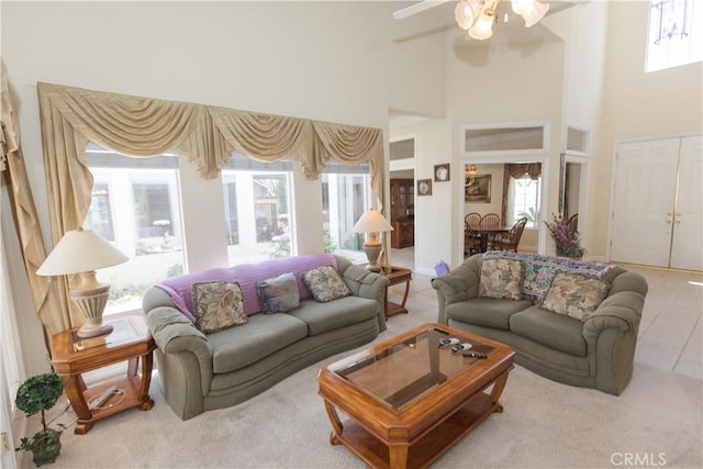337 W Trenton Ave, Clovis, CA 93619 - carpeted living area featuring a towering ceiling, a ceiling fan, and tile patterned floors