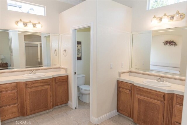 337 W Trenton Ave, Clovis, CA 93619 - bathroom featuring tile patterned flooring, a stall shower, and vanity