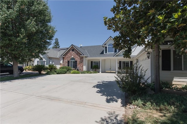 337 W Trenton Ave, Clovis, CA 93619 - view of front of property with driveway, brick siding, and an attached garage