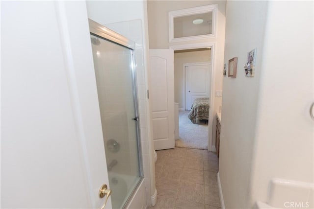 337 W Trenton Ave, Clovis, CA 93619 - bathroom featuring shower / bath combination with glass door, tile patterned floors, and ensuite bathroom