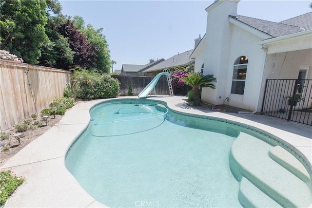 337 W Trenton Ave, Clovis, CA 93619 - view of swimming pool with a water slide and a fenced backyard