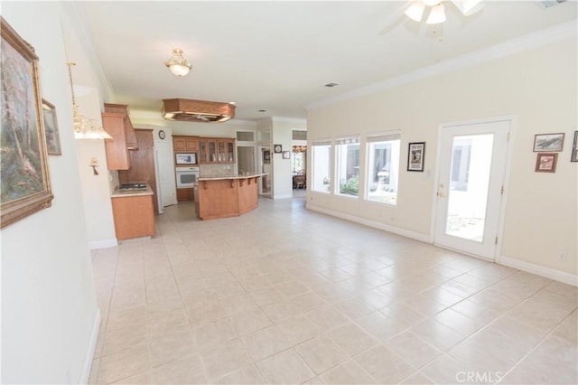 337 W Trenton Ave, Clovis, CA 93619 - unfurnished living room featuring ornamental molding, a ceiling fan, and light tile patterned flooring