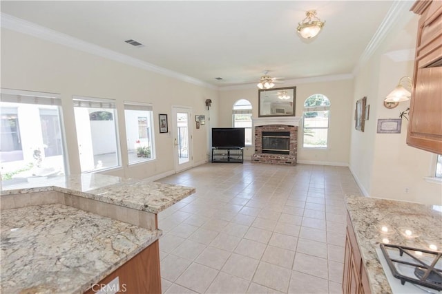 337 W Trenton Ave, Clovis, CA 93619 - living area with light tile patterned floors, a ceiling fan, crown molding, and a fireplace