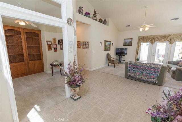 337 W Trenton Ave, Clovis, CA 93619 - living room with a ceiling fan, high vaulted ceiling, light colored carpet, and light tile patterned floors