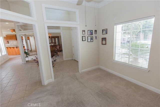 337 W Trenton Ave, Clovis, CA 93619 - empty room featuring a ceiling fan, a towering ceiling, light tile patterned floors, ornamental molding, and light carpet