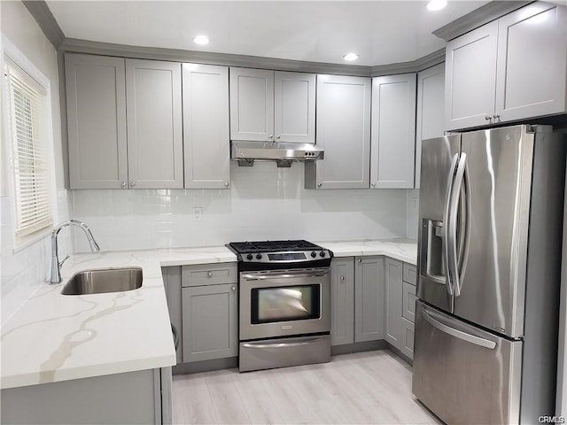 6171 Cleon Ave, North Hollywood, CA 91606 - kitchen featuring stainless steel appliances, gray cabinets, under cabinet range hood, light stone counters, and recessed lighting