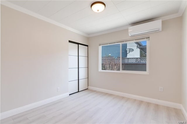 6171 Cleon Ave, North Hollywood, CA 91606 - spare room featuring a wall unit AC, ornamental molding, and wood finished floors